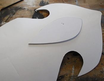 glue that tear drop shape onto the shield