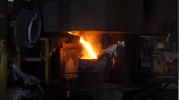 Pouring from the furnace into the ladle 