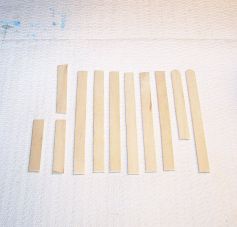 The craft sticks cut into pieces