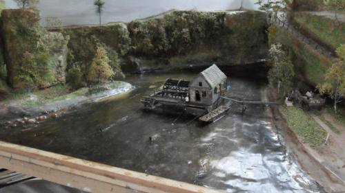 Boat mill on a river diorama