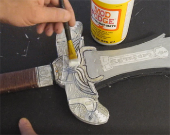 Seal the whole sword with mod podge