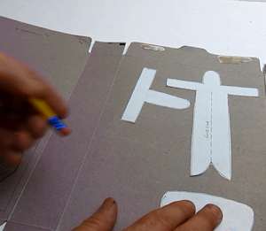 layout template pieces on cardboard