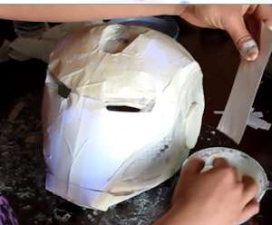 Apply plaster cloth or paper mache