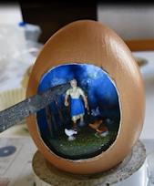 a diorama inside an egg 