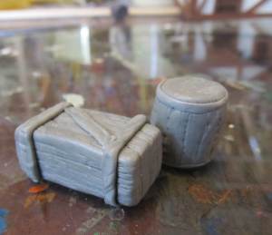 The sculpted miniature crates and barrels