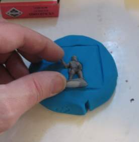 Press mini into the clay